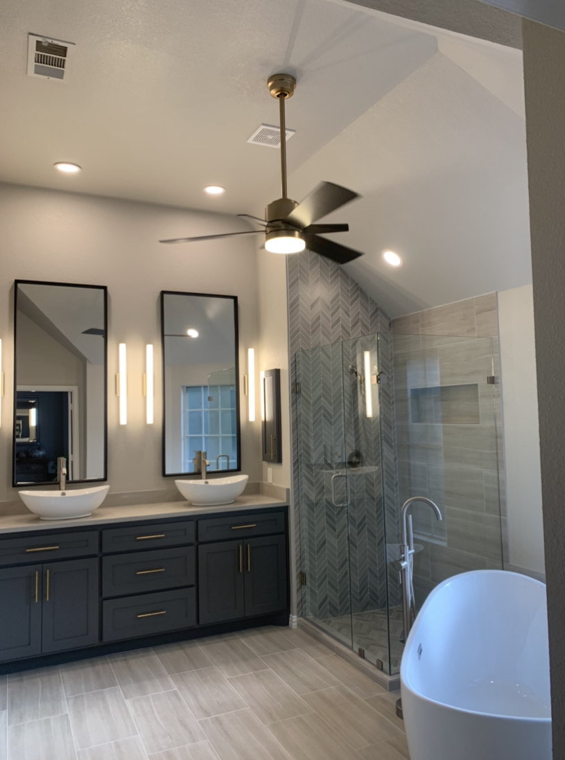  Beautiful tall mirrors accent these 12 foot ceilings. 