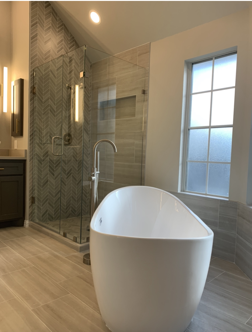  Enlarged frameless glass shower and free standing tub. 
